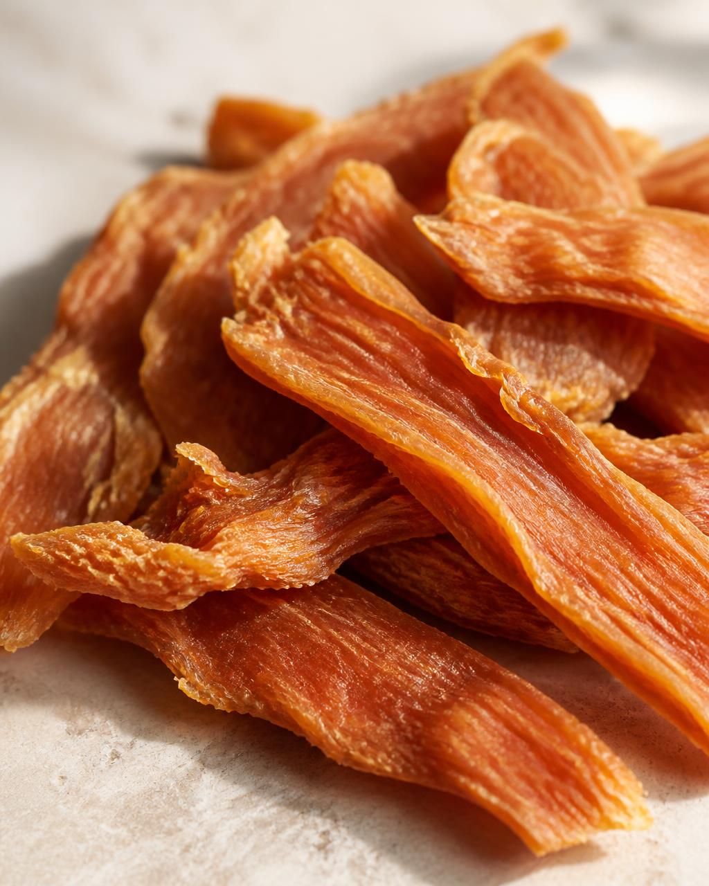 Close-up of dehydrated chicken jerky strips